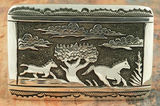 Beautiful Wild Horses Design in this Sterling Silver Belt Buckle. Created by Navajo Artist Tommy Singer. Signed by the artist.